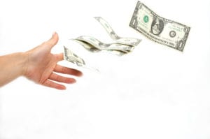 Image of hand throwing money away